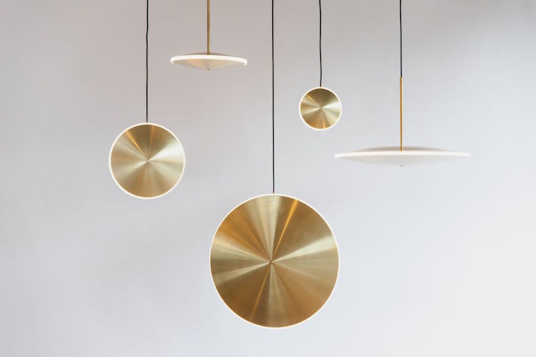 Each piece is made of spun brass and diffused acrylic and each lamp can be hung placing the disk vertically and horizontally