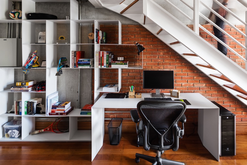 The under the stairs space features a desk with a chair, it's enough for working