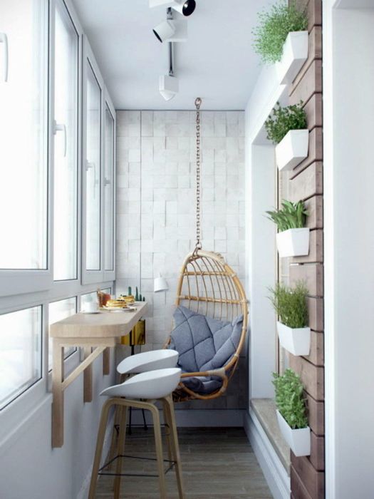 a balcony breakfast space with a wall-mounted table and tall stools plus a hanging chair