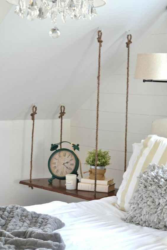 A swing style hanging nightstand is ideal for an attic bedroom and is very stable with 4 ropes