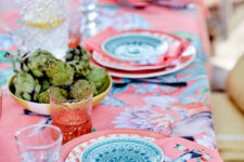 04 You may find coral pink tablecloths with floral prints, napkins with paradise birds and colorful plates