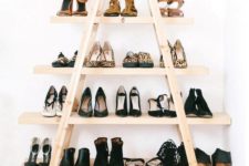 04 a stylish and comfy shoe shelf made of ladders and shelves will accomodate all your shoes and booties