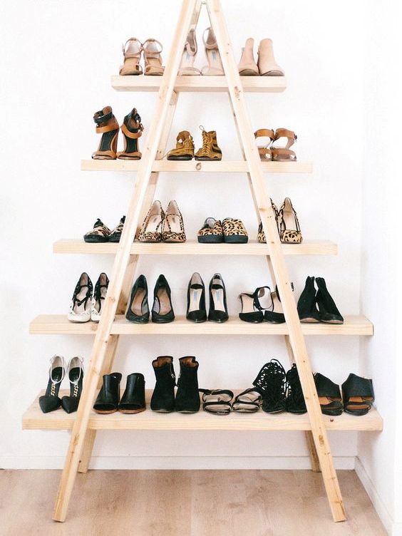 a stylish and comfy shoe shelf made of ladders and shelves will accomodate all your shoes and booties