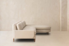 06 This L-shaped couch is a modern take on a usual L-shaped sofa, it features rounded angles and modern armrests