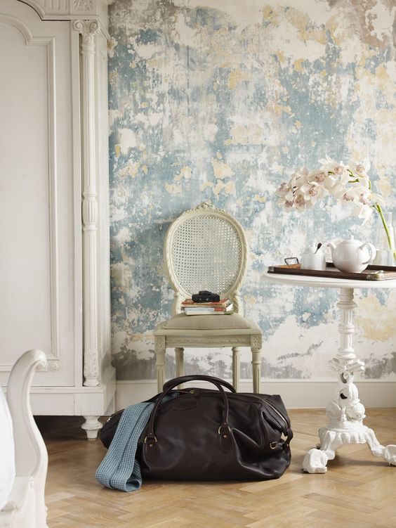 a grey shabby plaster wall plus vintage furniture create a dreamy shabby chic space