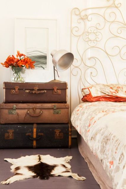 a stack of vintage suitcases is great for storage and will bring a vintage feel to the space