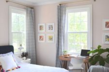 07 a cozy and wlecoming guest bedroom features a small desk by the window and a modern chair