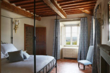 08 Here’s one of the bedrooms with an amazing canopy bed and blue textiles