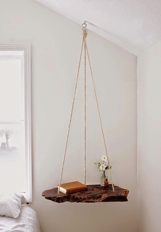 a creative nightstand of rope and a raw wood piece for a natural touch in the bedroom