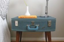 09 a vintage suitcase reupholstered and put on legs to create a cool nightstand