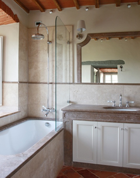The bathroom is done in neutrals and fully modernized for more comfort