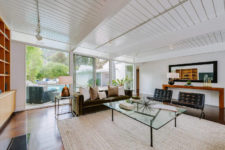 11 The living room is done with stylish mid-century modern furniture and feels very welcoming