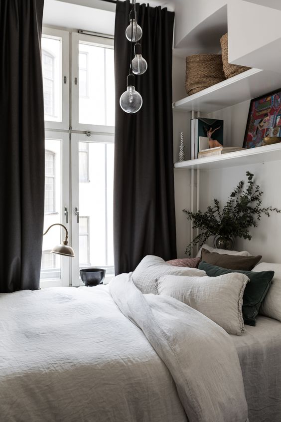 if there's a large window, some pendant lamps right over the bed are enough