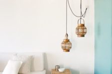 11 wicker pendants, basket for storage and as ottomans and a jute rug bring a clear beahc feel to the living room
