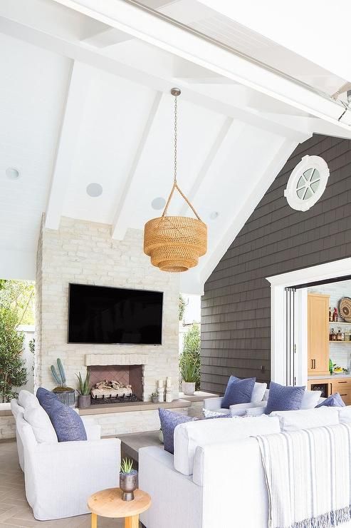 a coastal interior with three white sofas for creating a cozy conversation pit