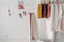 12 an ethereal girlish space with a hanging rack of rope and a tube for an airy look