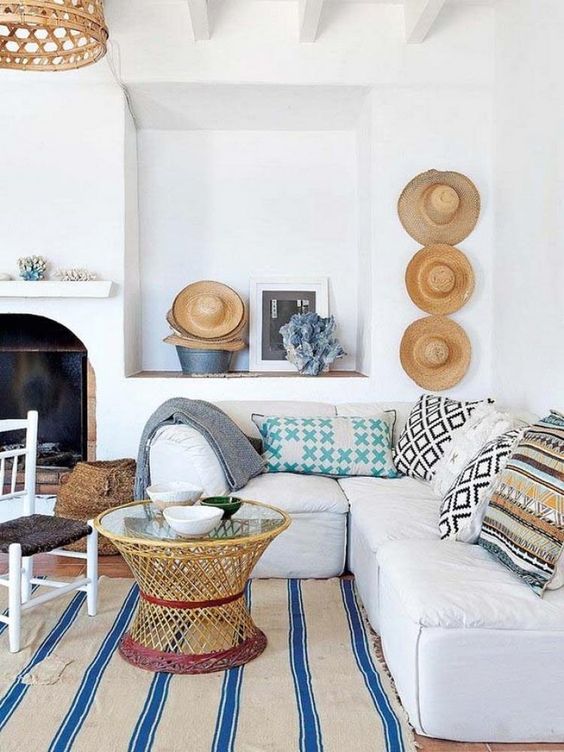 straw hats, a rattan pendant and a rattan table make the beach house cooler