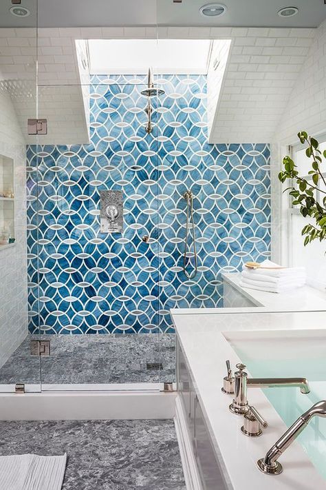a chic shower with mosaic tiles and a skylight for much light yet full privacy