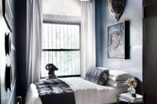 14 a large and bold chandelier makes a statement in this moody lux guest bedroom