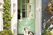 14 spruce up the entrance with a bright green Dutch door and a grass-style mat