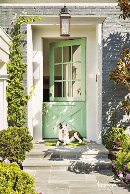 Spruce up the entrance with a bright green Dutch door and a grass style mat