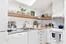 15 a small contemporary white kitchen with a skylight doesn’t seme too smal thanks to light and white