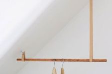 16 a creative idea for an attic space of a wooden stick and some leather loops looks chic