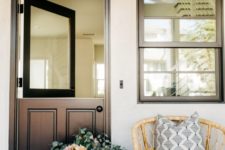 16 a stylish contemporary meets rustic entrance with a black Dutch door with a solid glass insert