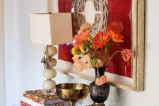 18 a bold artwork, bright blooms, some finds from trips for an inspiring entryway