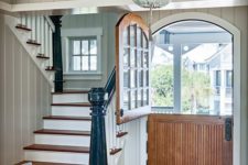 18 a rustic vintage entryway is made more special with a wood stained arched Dutch door