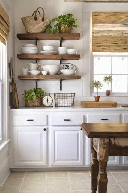 thick open shelves and dinnerware makes the kitchen look more cluttered