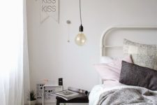 21 a small black ladder can be a nice nightstand idea for a Scandinavian bedroom