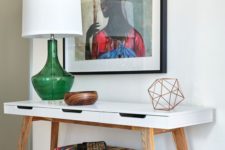 21 a super colorful artwork, a bright upholstered ottoman and a green lamp for summer