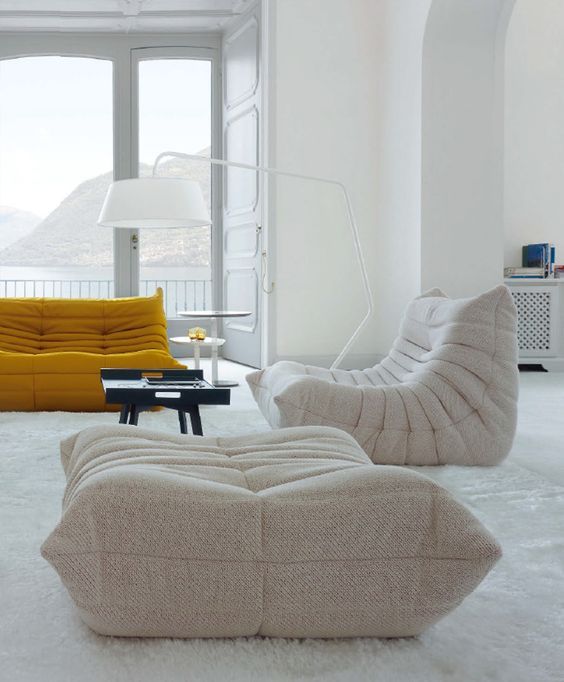 a creative modern off-white loveseat and a matching mustard one for a bold contemporary space