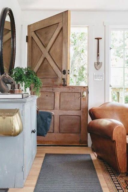 a rustic stained wooden door with no glass adds to the rustic living room