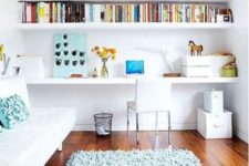24 an airy and bright space with built-in shelves and a desk plus a small sofa to turn into a bed