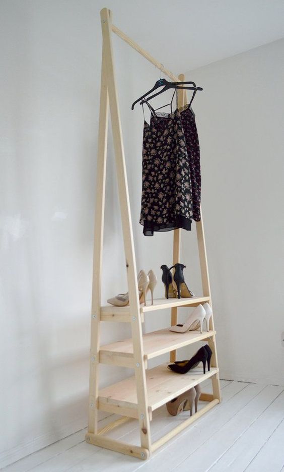 A light colored wooden rack for clothes and step shelves for shoes can be handmade