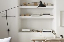 26 place a convertible sofa and a small lightweight desk plus built-in shelves to save much space