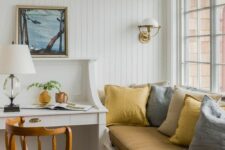a cozy room with a shiplap accent wall