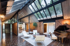 01 This mid-century modern house features a lot of skylights and spaces separated with glass dividers