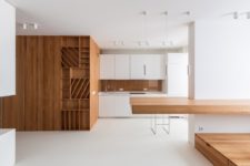 01 This ultra-minimalist apartment is done of white and rich-colored wood and features maximal functionality and the best organization of space