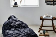 02 a black chunky knit bean bag chair is a great one for a wabi-sabi space