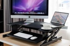 02 a small black height adjustable sit-stand desk with a keyboard tray for any office