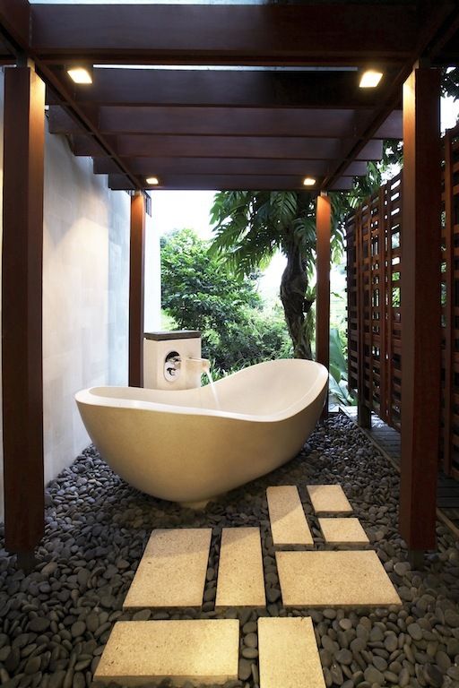 place your bathtub next to the house all and cover it with a wooden screne on the other side to feel comfy