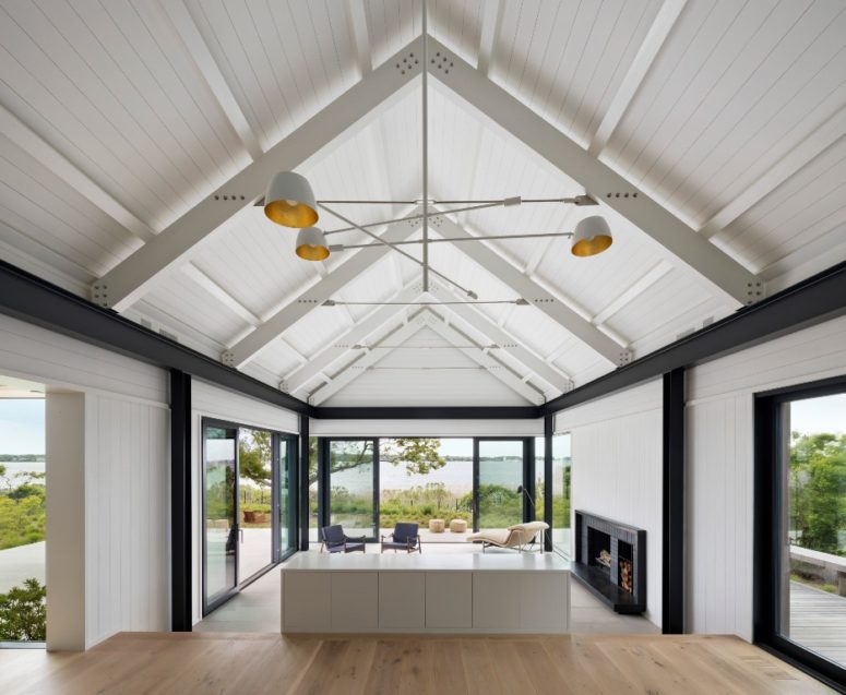 The house features a gabled roof and lots of glazign to catch all the possible views