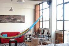 03 a colorful hammock is a fun and relaxed touch to a plain and usual space
