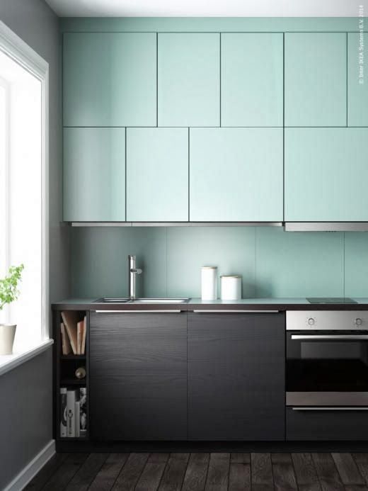 a minimalist kitchen in mint and very dark stained wood for a contrasting modern look