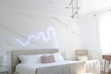 03 a neon light piece over the bed is a great idea to spruce up the space and make it modern and bold