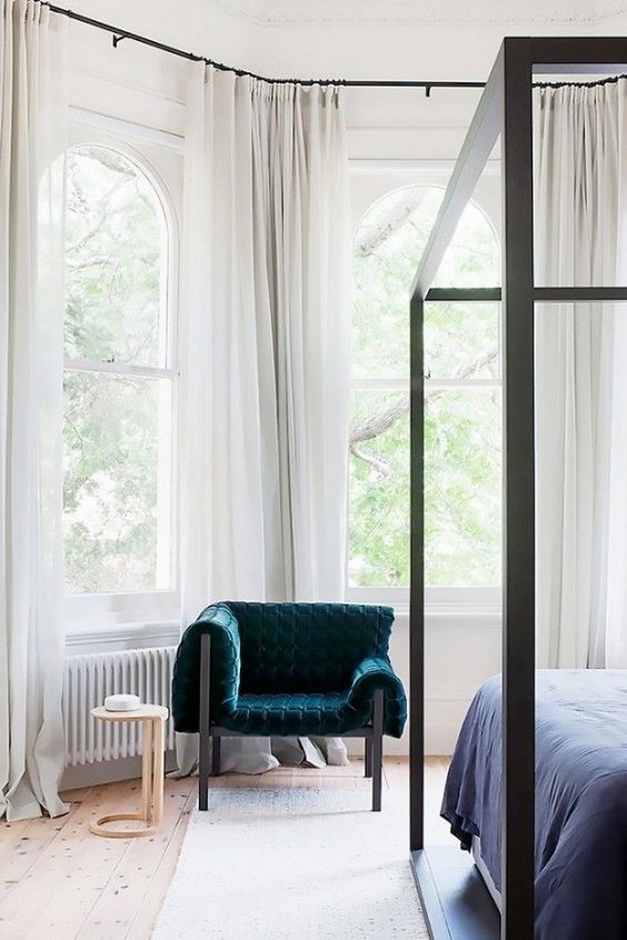 put just one bold chair in the neutral bedroom and it'll be a bright statement
