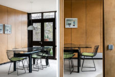 05 Further you will see a cool dining zone with a black metal table with a glass top and green chairs